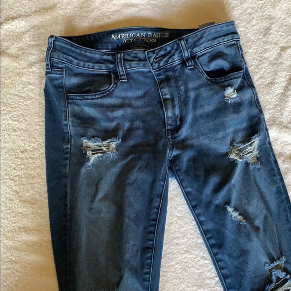 Distressed blue jeans